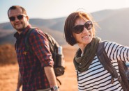 Young family outside on a hike in sunglasses